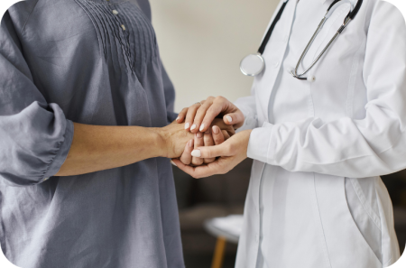 covid-recovery-center-female-doctor-holding-older-patient-s-hands